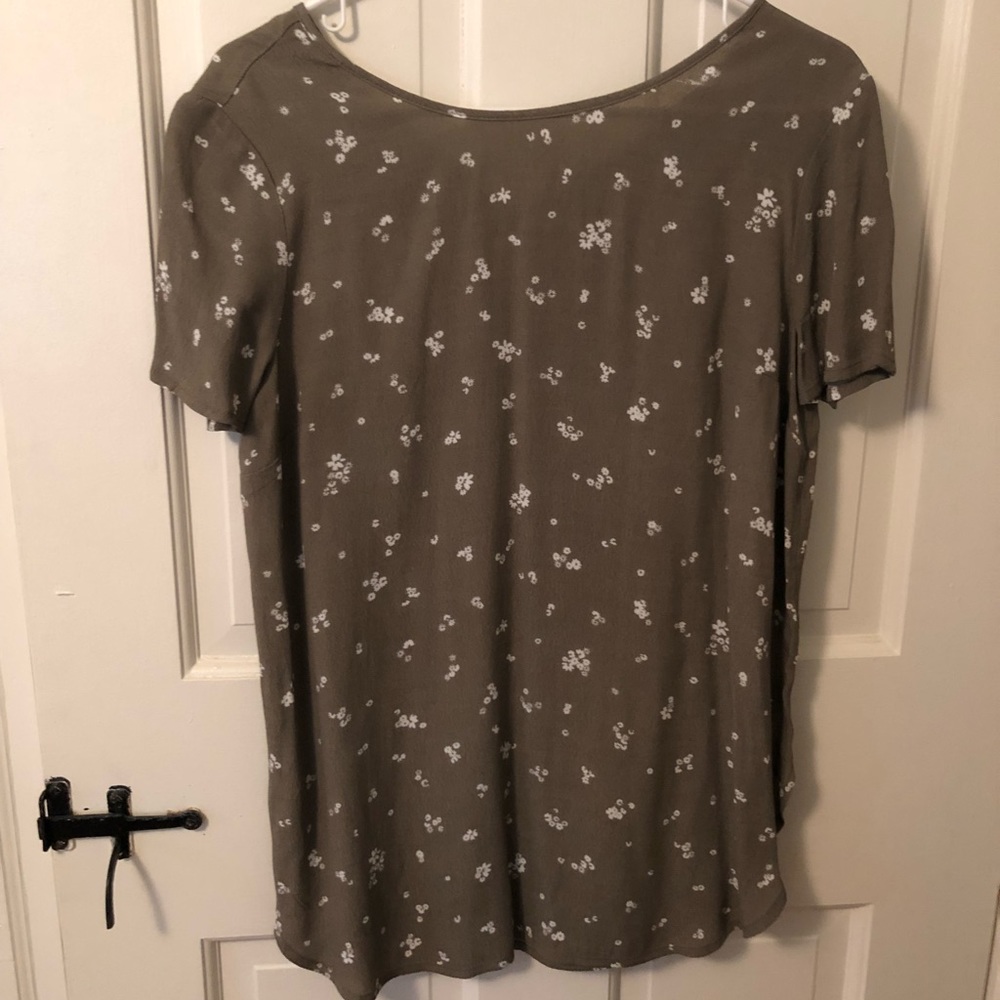 Green blouse with white flower detail